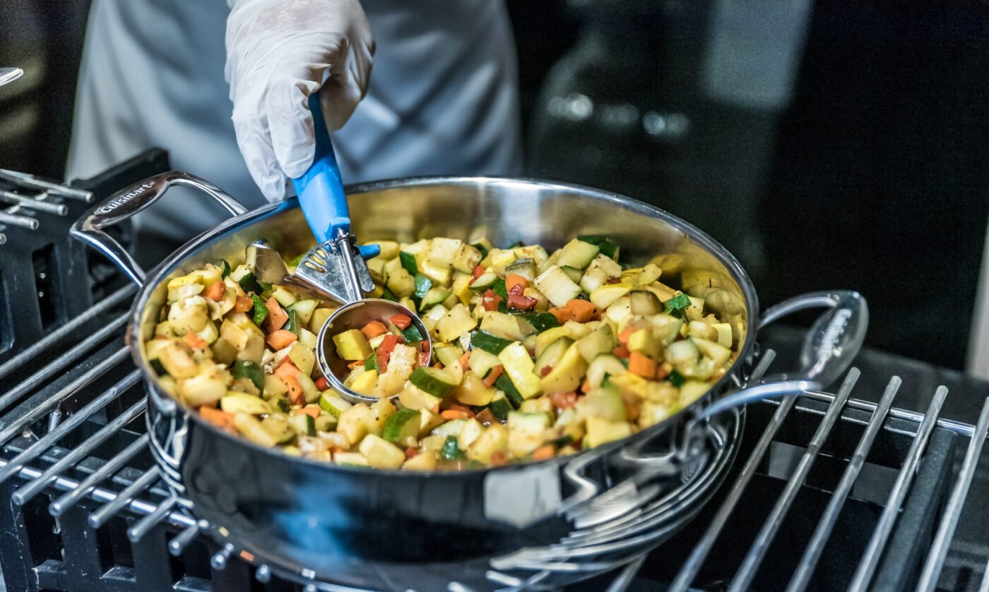 preparing-fresh-sauteed-vegetables-with-a-blue-ute-2026-03-26-10-23-00-utc
