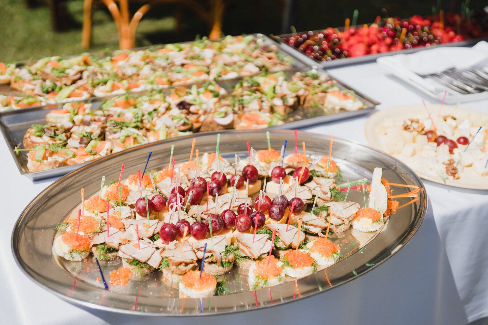 Catering banquet table at reception. Restaurant presentation, european cuisine, food consumption, party concept. Food styling, appetizers bar, welcome drink, event design.